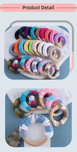 Detailed view of colorful hand-woven cotton rope on natural wooden baby teething rings