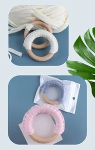 Macro detail of wooden baby teether rings with soft colorful cotton woven textures