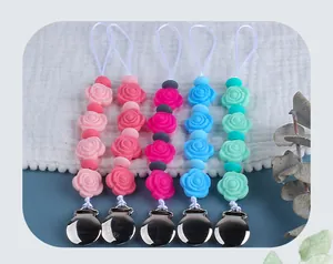 Detailed set of 5 silicone rose flower pacifier clips with metal buckles in various colors