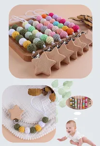 Close-up of handmade crochet beads and wooden star clip on a baby pacifier chain