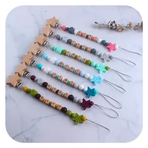 DIY beechwood star pacifier clips with silicone beads in various macaron colors