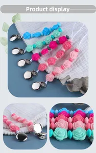Detail view of five assorted silicone rose pacifier clips with secure metal fasteners