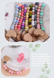 Detail of beech wood heart clip and food-grade silicone beads on a pacifier chain