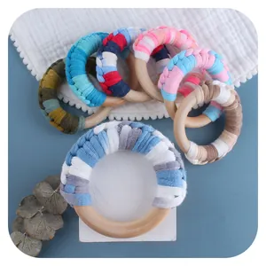 Handmade baby wooden teething rings with colorful woven cotton rope for sensory play