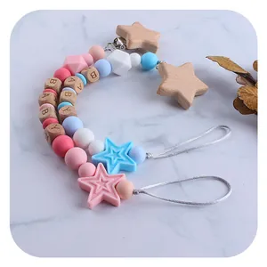 DIY beech wood and silicone baby pacifier clip with star motifs and alphabet beads
