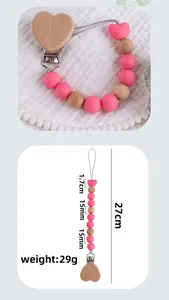 Detail of wooden heart pacifier clip with dimensions 27cm length and 15mm pink beads
