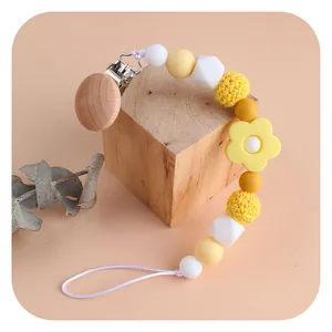 Beechwood baby pacifier clip with colorful silicone flower beads and crochet accents