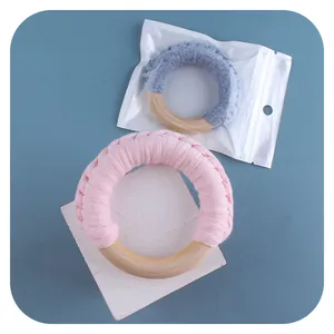 Handmade baby wooden rattle rings with pink and blue crochet cotton for teething