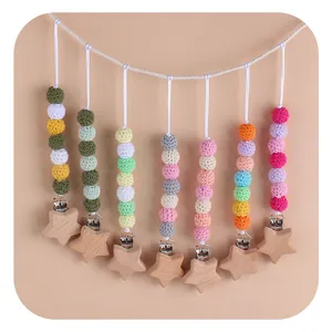 Handmade beech wood star pacifier clips with colorful crochet beads for infants