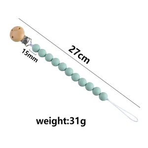Schnullerkette aus minzgrünen Silikonperlen mit Holzclip, Gesamtlänge beträgt 27cm