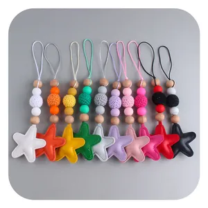 Set of ten colorful star keychains featuring silicone beads and knit textures