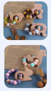 Detail of wooden animal teether set with colorful food-grade silicone beads for babies