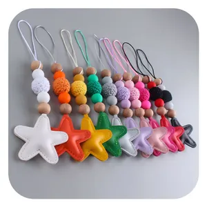 Colorful star keychains with silicone beads and crochet balls in ten vibrant colors