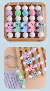 Detail of elephant silicone teether necklace with colorful beads and grey safety cord