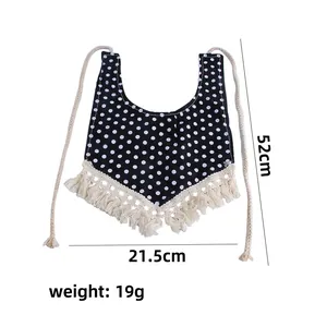 Black polka dot cotton pet bandana with cream fringe trim and adjustable ties