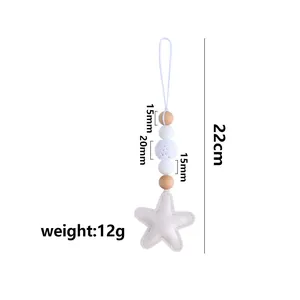 Star-shaped crochet bead keychain featuring white silicone and natural wood elements