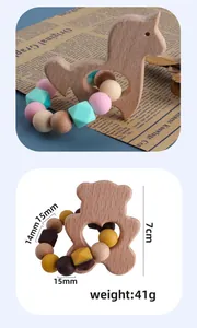Close-up of baby beech wood unicorn teether with macaron silicone beads and size details