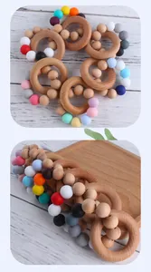 Detailed view of baby teething ring with natural beech wood and macaron silicone beads
