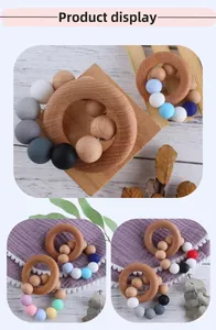 Detailed view of macaron colored silicone beads and natural beech wood baby teething rings