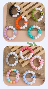 Detailed close-up of colorful silicone teething bracelets with cartoon animal beads