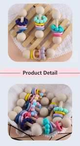 Detail of wooden baby rattle with colorful silicone rings and natural beads set