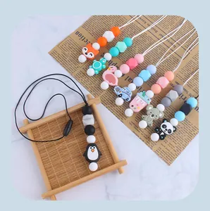 Detail view of colorful silicone teething beads and cute cartoon animal pendants for infants