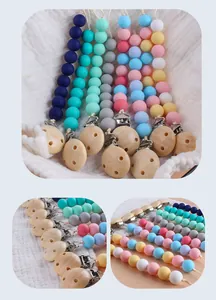 Detailed close-up of silicone beads and wooden clips on colorful baby pacifier chains