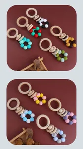 Macro shot of colorful food-grade silicone beads and smooth natural beech wood rings