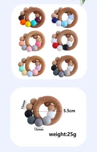 Detailed macro view showing the 5.5cm beech wood ring and 15mm food-grade silicone beads
