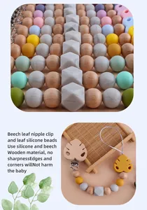 Detail showing natural beech wood leaf clip and soft food-grade silicone beads for baby