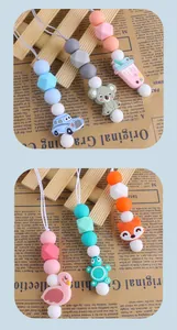 Detail of colorful silicone baby teether beads with various cartoon animal clips