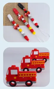 Macro detail of silicone pacifier clip set with red fire truck pendant and colorful beads