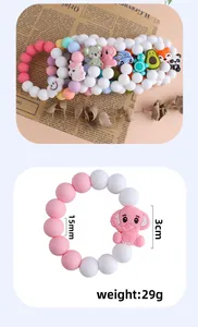 Detail of 15mm silicone beads and 3cm animal charms for baby teething bracelet DIY