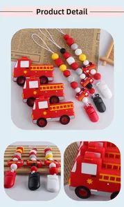 Detailed close-up of fire truck silicone pacifier clips with colorful safety beads
