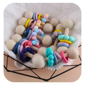 Baby wooden teether and rattle set with colorful macaron silicone beads in a basket