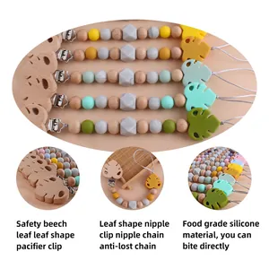 Beech wood and silicone leaf pacifier clips in Nordic colors for baby teething