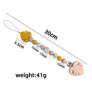 Handmade beech wood and silicone baby pacifier clip with yellow leaf teether, 30cm length