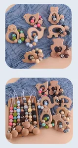 Detail of wooden animal teether rings and pacifier clips with leopard silicone beads