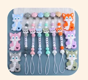 Anelli dentizione volpe in silicone e catenelle porta ciuccio in colori pastello misti