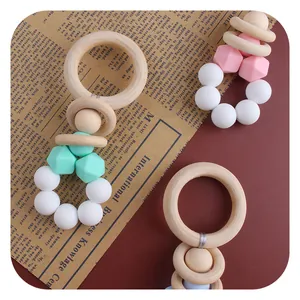 DIY baby teething toy with natural wooden rings and macaron silicone beads for infants