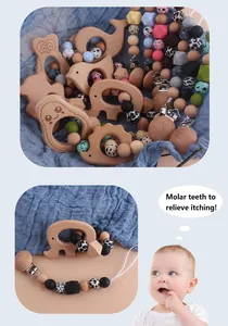 Detail of wooden animal teether set with leopard print silicone beads and metal clip