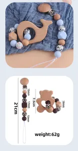 Detail view of beech wood whale teether and silicone pacifier clip with measurements