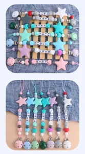Detail of colorful silicone baby pacifier clips with heart and star beads and baby letters