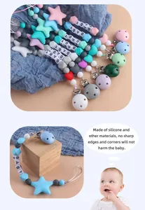 Detailed view of silicone pacifier clip with baby letter beads and star charms
