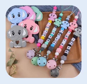 Macro detail of elephant silicone teether with pastel beads and baby letter cubes