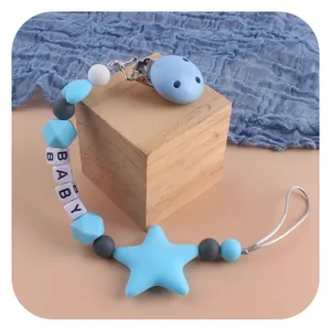 Blue silicone baby pacifier clip with star bead and baby letters on wooden cubes