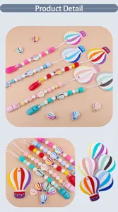 Detailed view of colorful hot air balloon silicone baby teether clips and pacifier beads