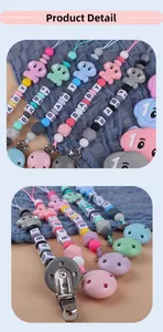 Close-up of silicone baby pacifier clip with elephant charm and colorful BABY beads
