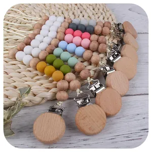 Beech wood and colorful silicone bead pacifier clip set displayed in a fan shape
