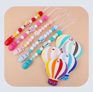 Detailed set of silicone baby teethers in hot air balloon shapes with matching bead clips
